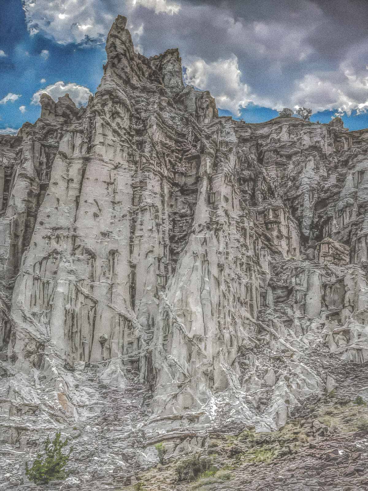 Stunning natural rock formation in Abiquiu, New Mexico with a blue sky and clouds in the background