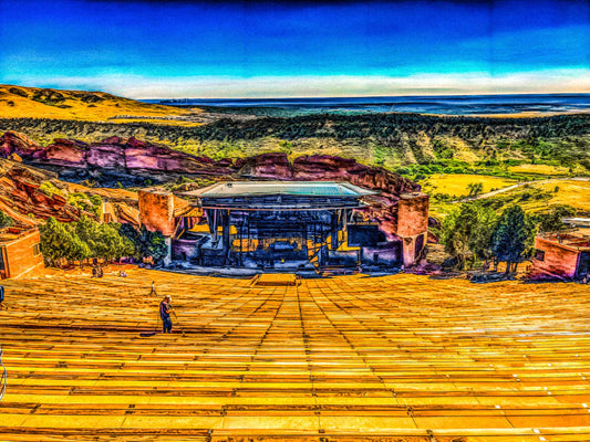 Red Rocks Amphitheater Morrison, Colorado with red rock formations and a clear blue sky.