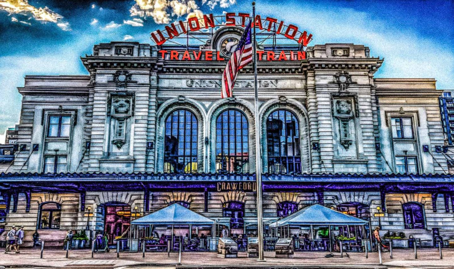 Denver, Colorado Union Station with a clear blue sky and American flag.